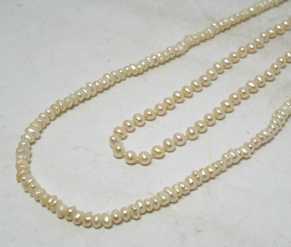 A single strand cultured pearl choker necklace, with 375 clasp, 38cm, together with a freshwater pearl necklace with 925 clasp. Condition - fair
